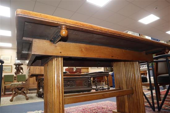 An Art Deco 1920s oak extending dining table L.137cm